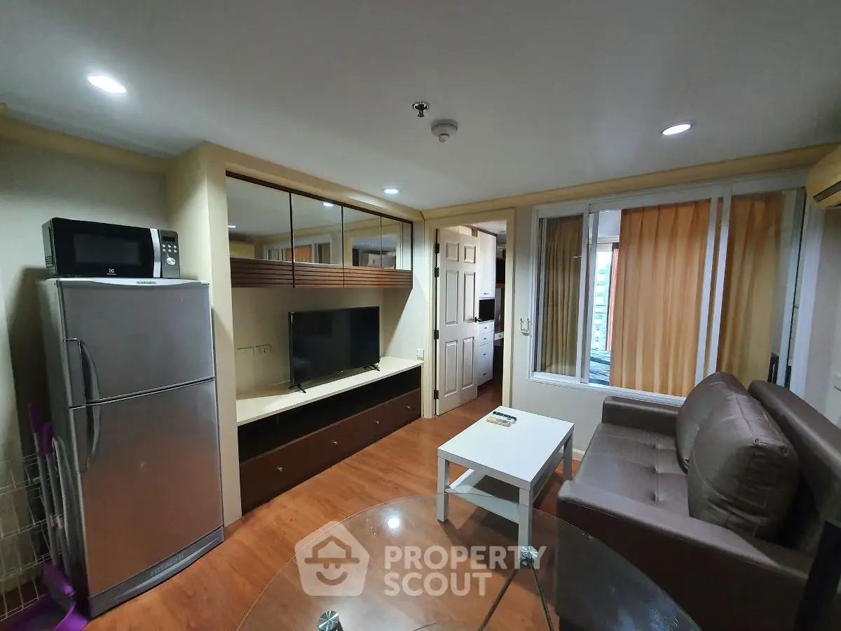 Cozy living room with modern appliances and stylish decor in urban apartment