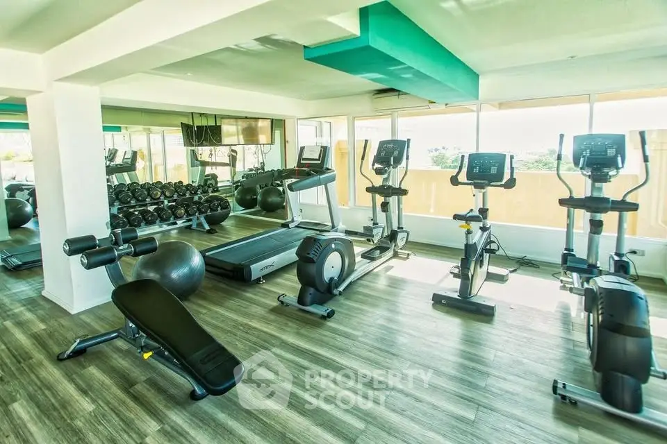 Modern gym with state-of-the-art equipment and bright natural lighting