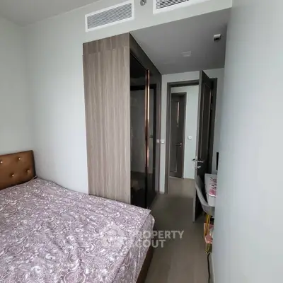 Cozy bedroom with modern wardrobe and stylish decor