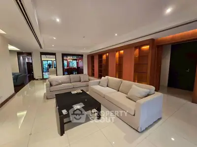 Spacious modern living room with elegant sofas and sleek tile flooring