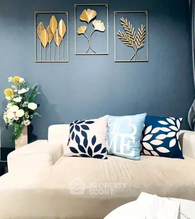 Stylish living room with modern decor and cozy sofa, perfect for relaxation.