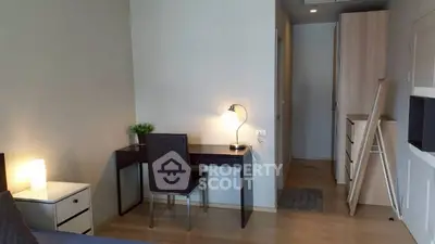 Modern study area with sleek desk and chair in a stylish apartment.