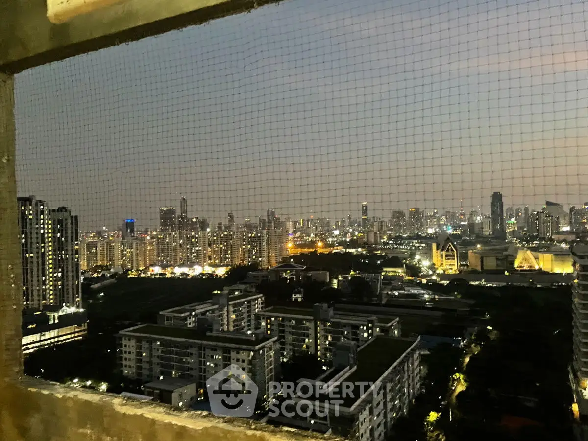 Stunning city skyline view from high-rise balcony at dusk