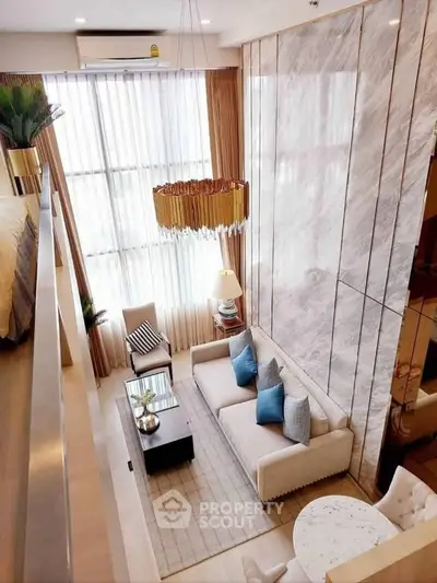 Luxurious modern living room with high ceilings and elegant decor in a stylish apartment.