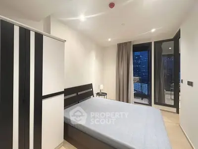 Modern bedroom with balcony view in urban apartment