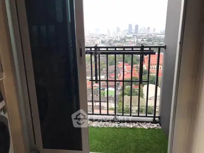Charming balcony with artificial grass and stunning city view, perfect for relaxation and enjoying urban scenery.