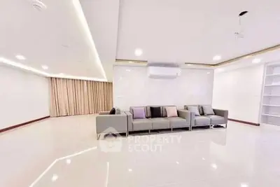 Spacious modern living room with sleek design and elegant lighting