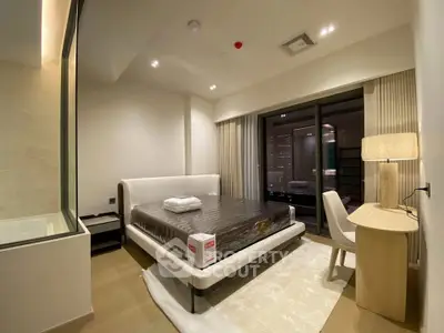Modern bedroom with large bed, stylish desk, and floor-to-ceiling windows in a luxury apartment.