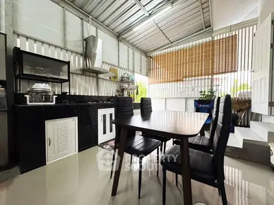 Modern kitchen with sleek dining set and open layout design