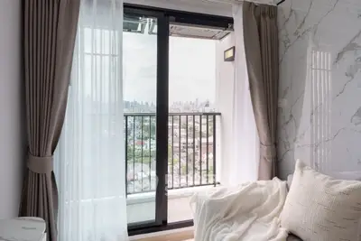 Cozy living room with balcony view in modern apartment