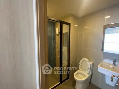 Modern bathroom with glass shower and sleek fixtures