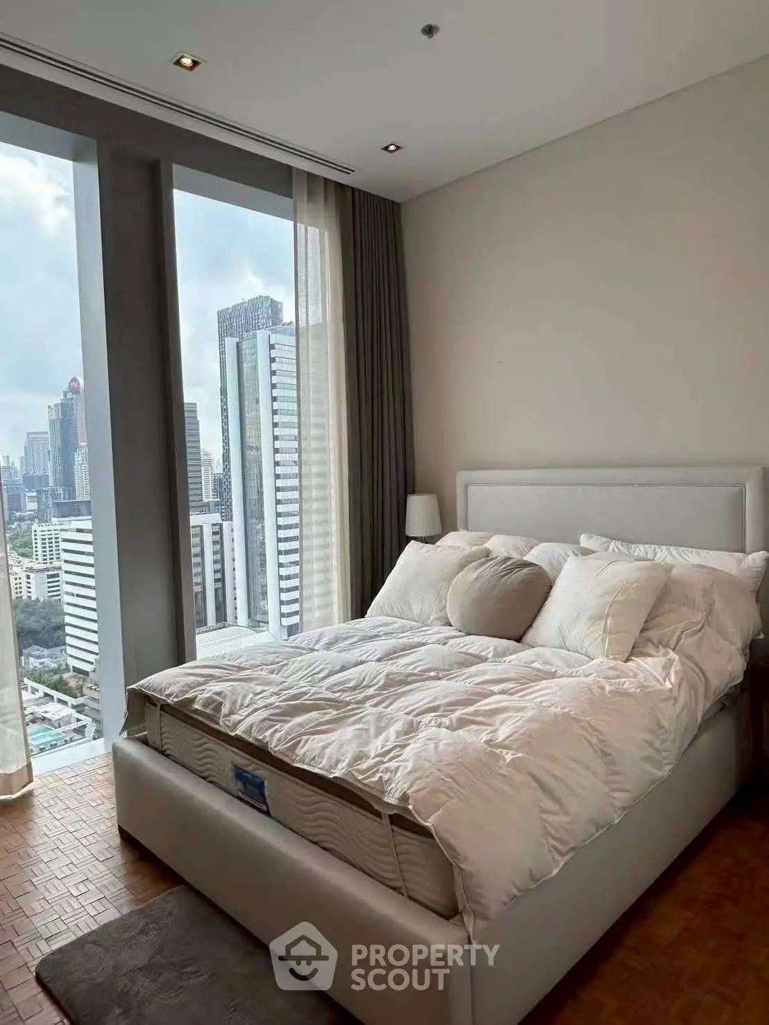 Luxurious bedroom with stunning city view and modern decor