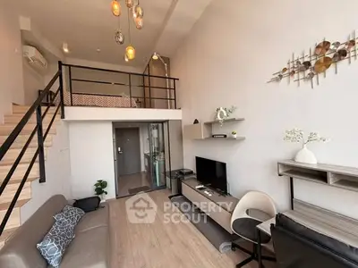 Modern loft-style living room with mezzanine, stylish decor, and open layout, perfect for urban living.