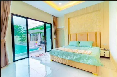 Luxurious bedroom with pool view and modern design