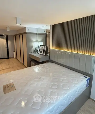 Modern bedroom with stylish decor and comfortable mattress in a contemporary apartment