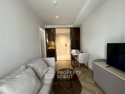 Modern living room with sleek furniture and stylish decor in a contemporary apartment.