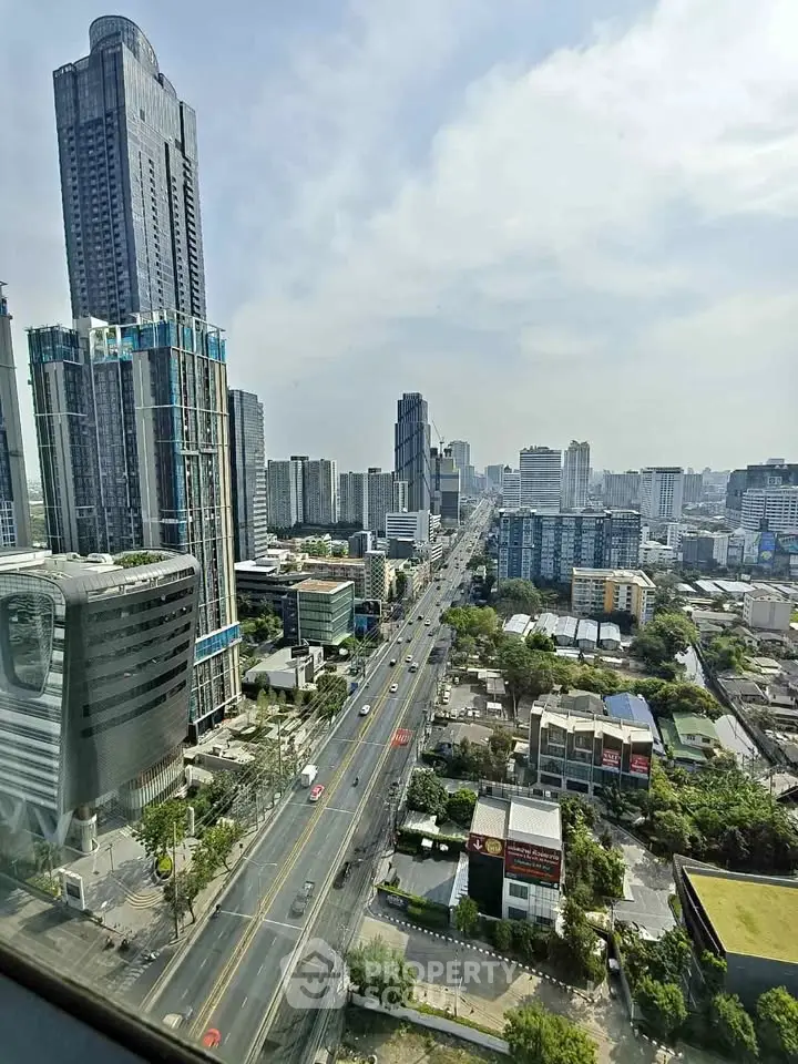 Stunning cityscape view showcasing modern skyscrapers and bustling urban life from a high vantage point.