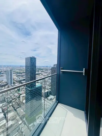 Stunning high-rise balcony with panoramic city views, perfect for urban living enthusiasts.