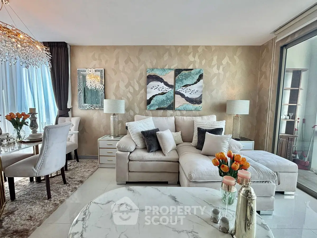 Luxurious living room with elegant decor and large windows offering natural light