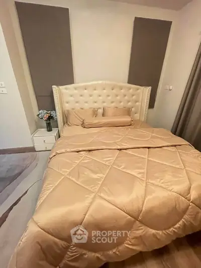 Luxurious bedroom with elegant tufted headboard and cozy bedding