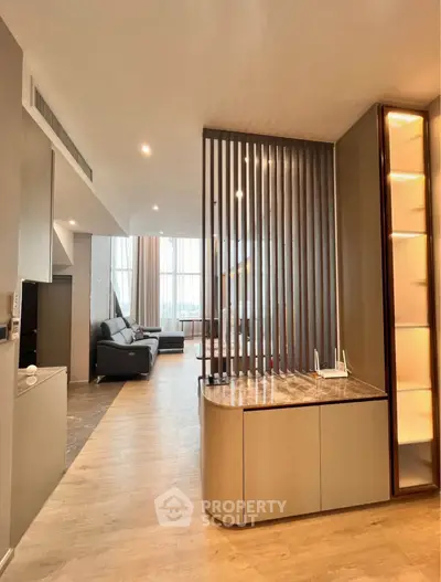 Modern living room with stylish partition and elegant decor