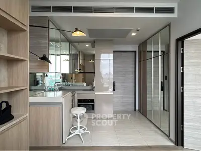 Modern apartment interior with mirrored cabinets and sleek design