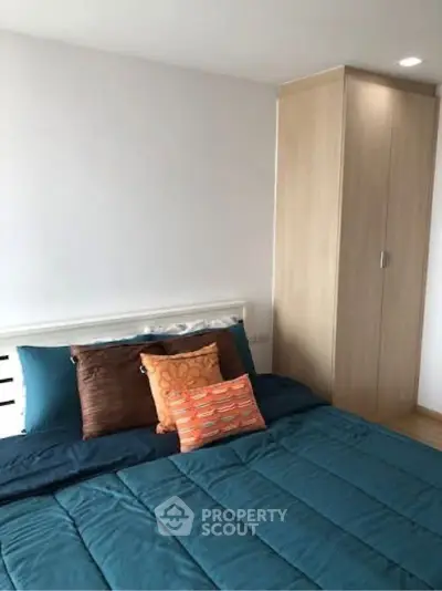 Cozy bedroom with modern decor and ample storage space