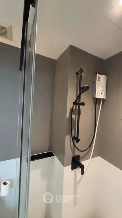 Modern bathroom with sleek shower design and contemporary fixtures.