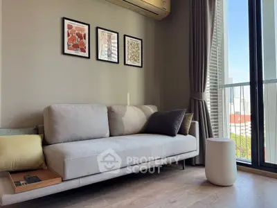 Modern living room with sleek sofa and city view through large windows.