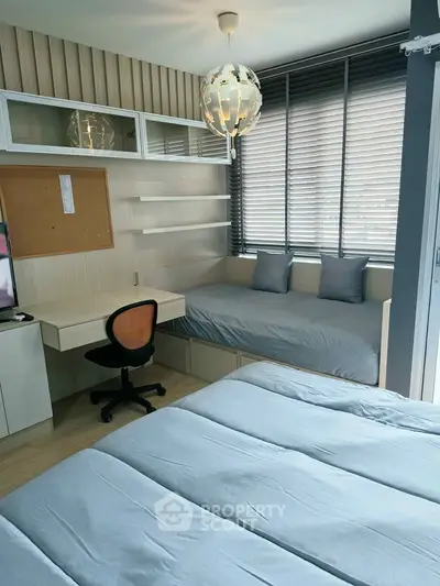 Modern bedroom with stylish decor, featuring a cozy bed, study desk, and ample natural light.