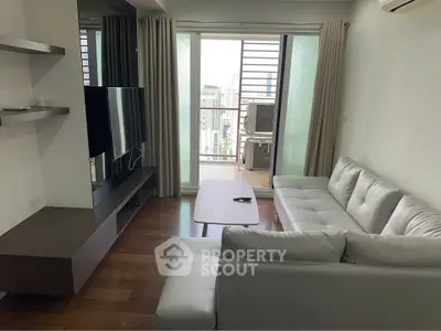 Modern living room with sleek furniture and balcony view in urban apartment