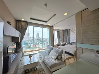 Luxurious modern living room with city view, open layout, and elegant decor in high-rise apartment.
