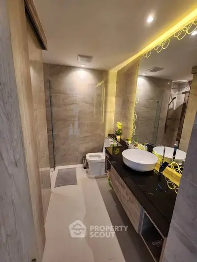 Luxurious modern bathroom with elegant fixtures and ambient lighting