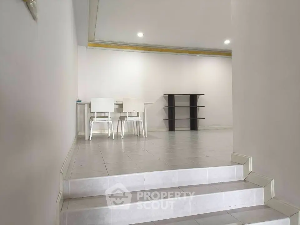 Spacious interior with modern dining area and tiled flooring