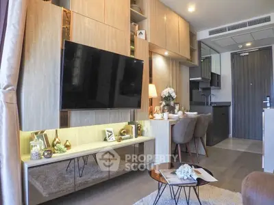 Modern living room with stylish decor and open kitchen layout in a contemporary apartment.