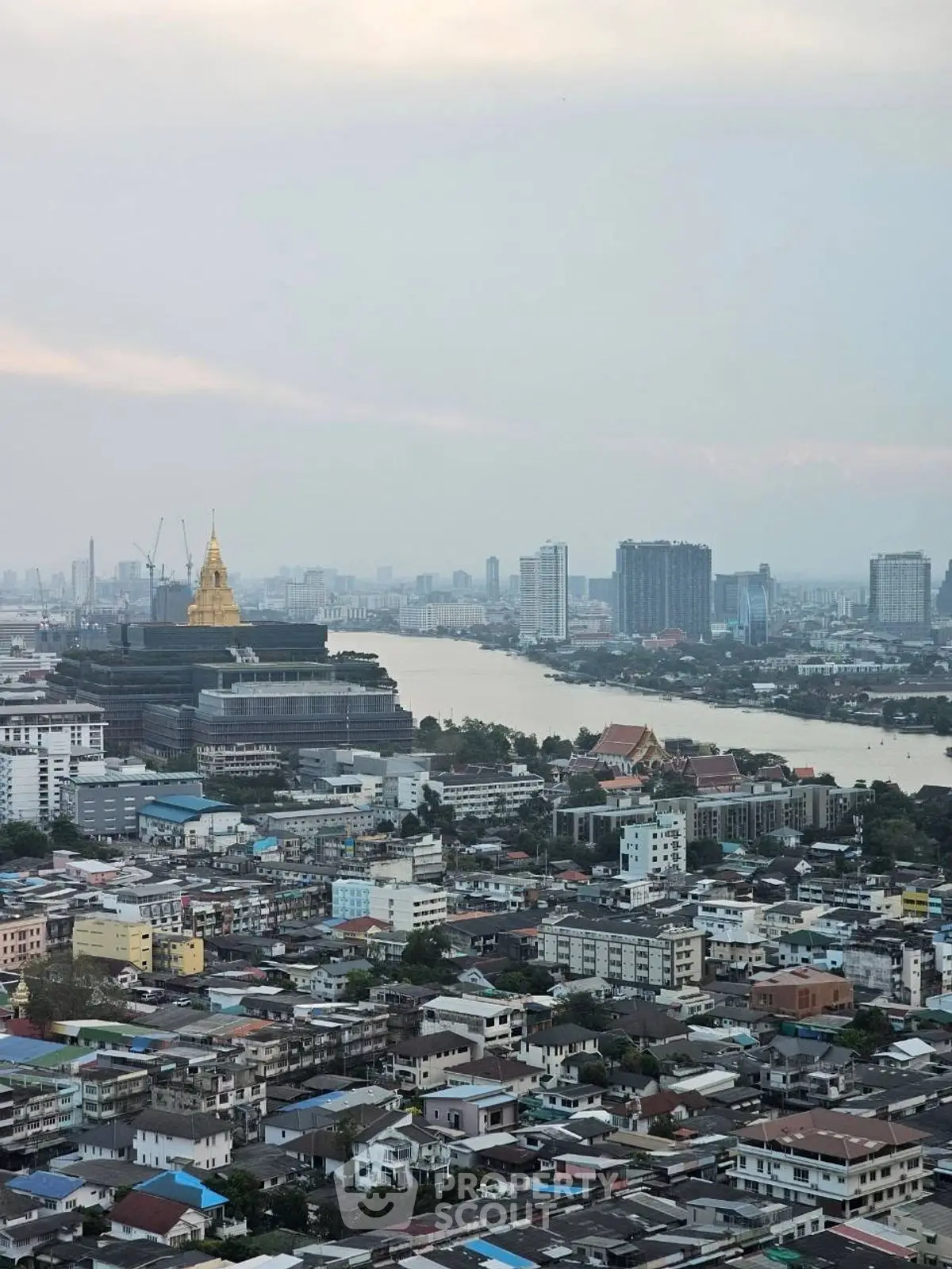 Stunning cityscape view showcasing a river and urban skyline, perfect for real estate investment.