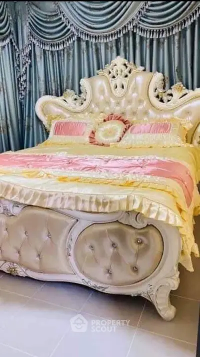 Luxurious bedroom with ornate bed and elegant drapery, perfect for a royal living experience.