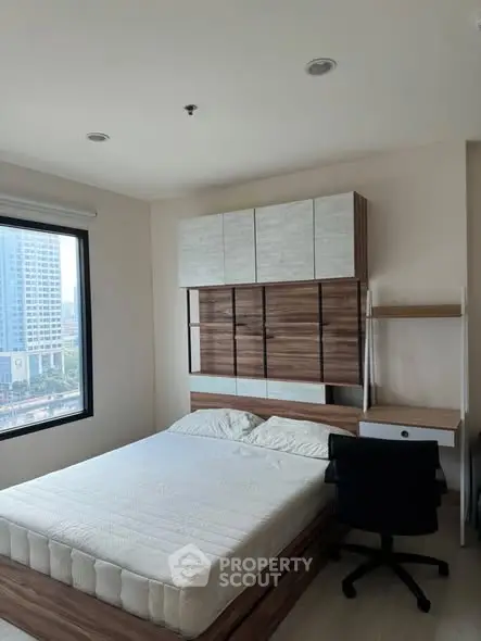 Modern bedroom with city view and stylish wooden furniture