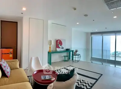 Spacious modern living room with stylish decor and large windows