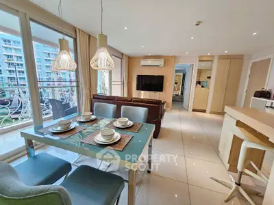 Spacious modern living room with elegant dining area and balcony view