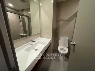 Modern bathroom with sleek fixtures and neutral tones