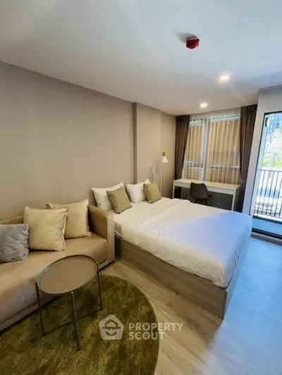 Modern studio apartment with cozy bed and stylish decor
