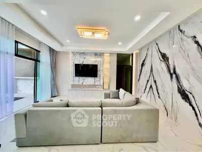 Luxurious modern living room with marble accents and plush sectional sofa