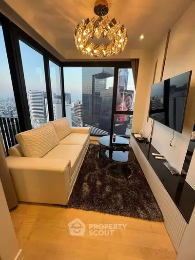 Luxurious living room with panoramic city views, elegant chandelier, and modern furnishings.