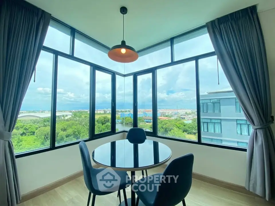 Stunning corner unit with panoramic views and modern dining area.