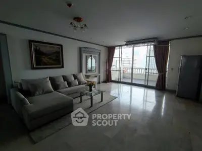 Spacious living room with large windows and city view, featuring modern furniture and elegant decor.