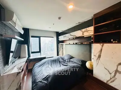 Luxurious bedroom with city view, modern decor, and ample storage space.