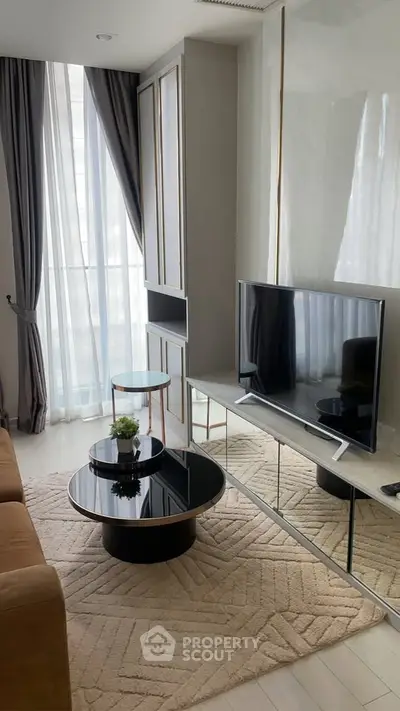 Modern living room with sleek TV setup and stylish furniture