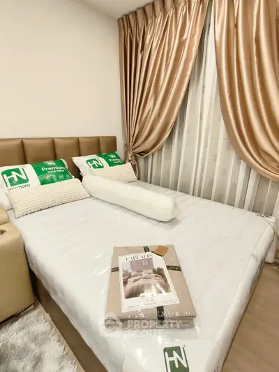 Cozy bedroom with elegant curtains and plush bedding, perfect for relaxation and comfort.