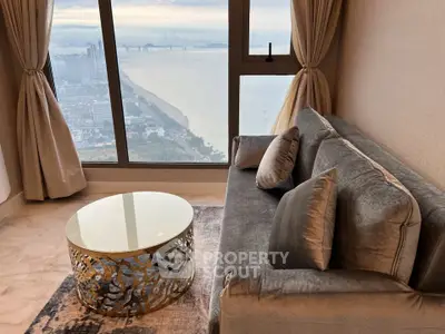 Luxurious living room with stunning ocean view and elegant furnishings
